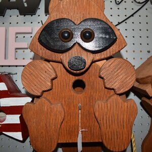 Amish made raccoon bird house. 20 inches long by 12 wide